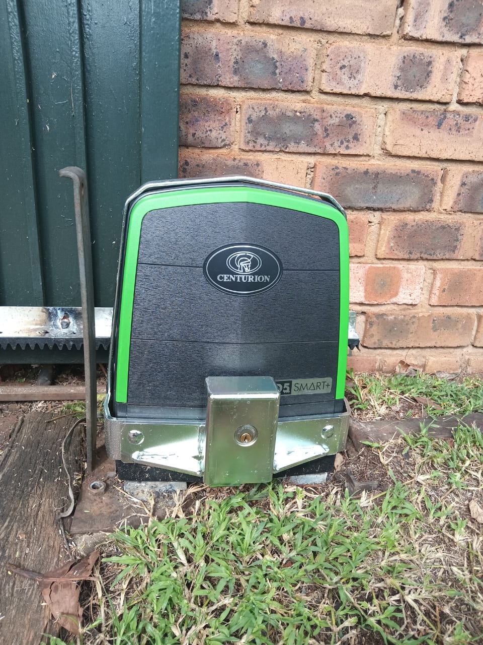 Centurion D5 Smart+ sliding gate motor fitted with a lockable steel bracket